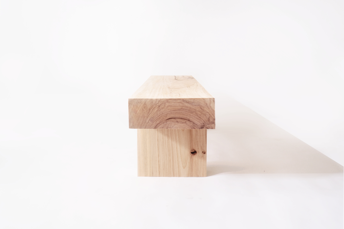 A simple bench made in tribute to natures raw material by Olli Karvonen